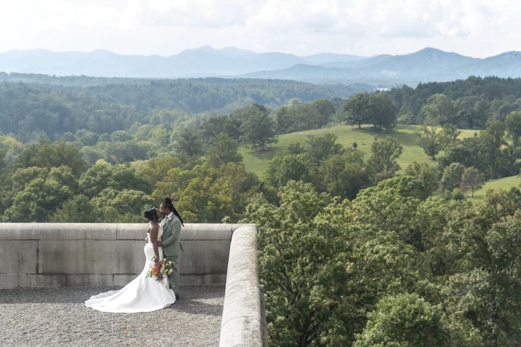Biltmore Estate south terrace landscape of Blur Ridge Mountains with couple holding each other in lower left corner