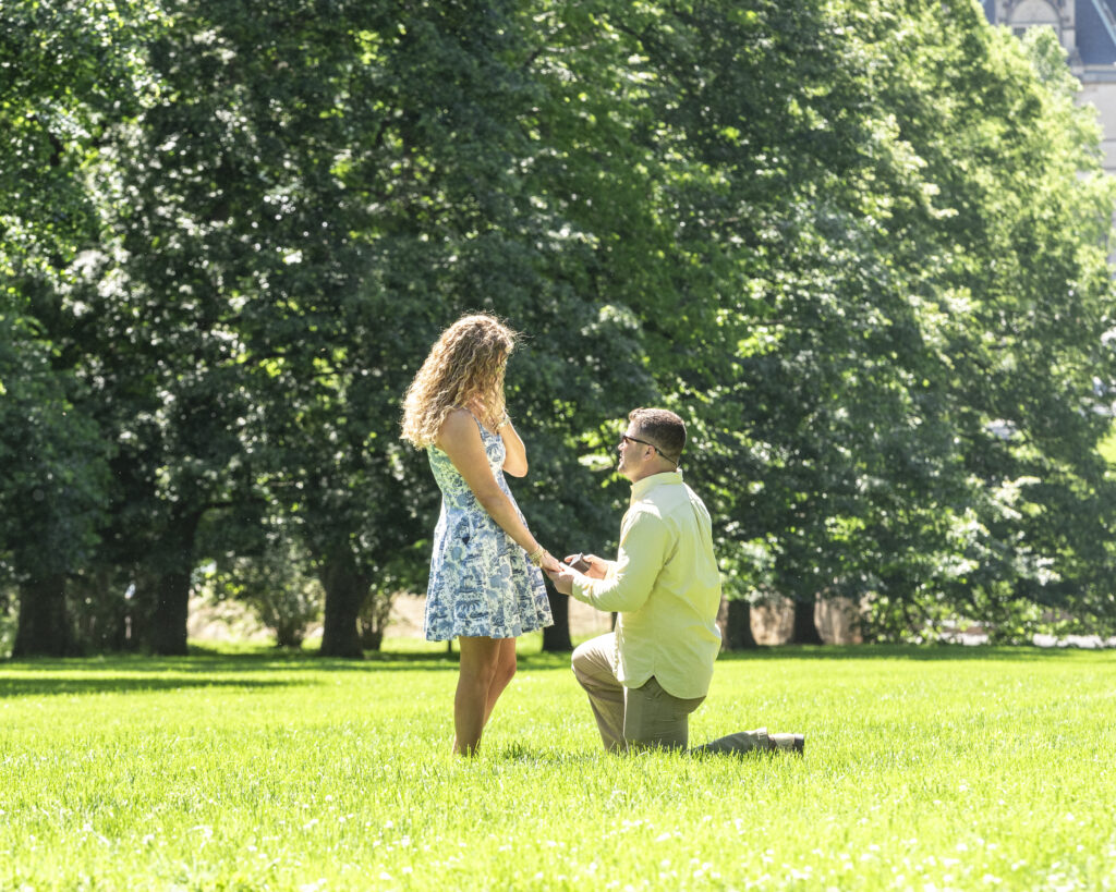 Biltmore estate proposal, man on one knee proposing to his girlfriend at the top of Diana Lawn
