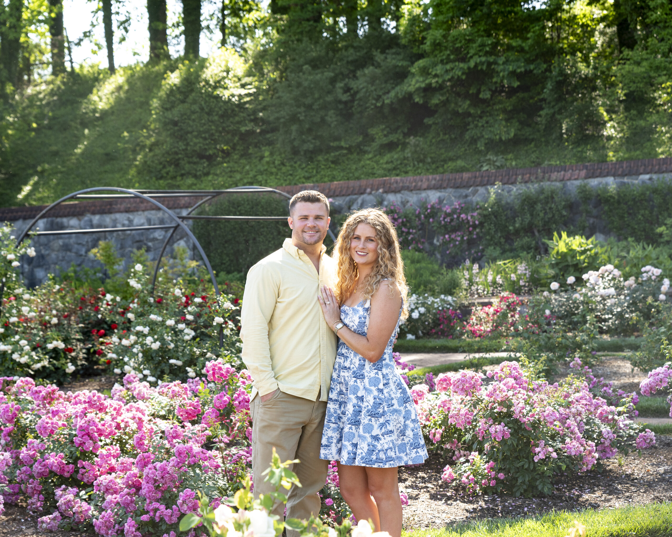 couple standing together looking at camera in Biltmore estate rose garden