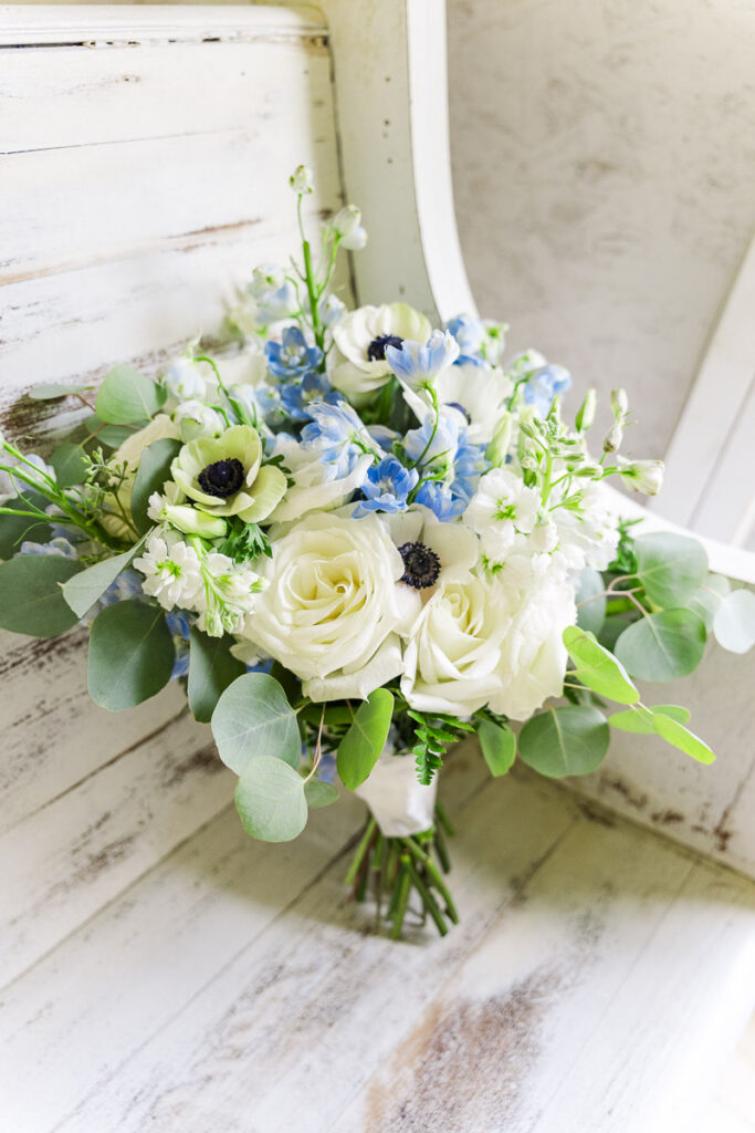 bridal bouquet sitting on chapel pew