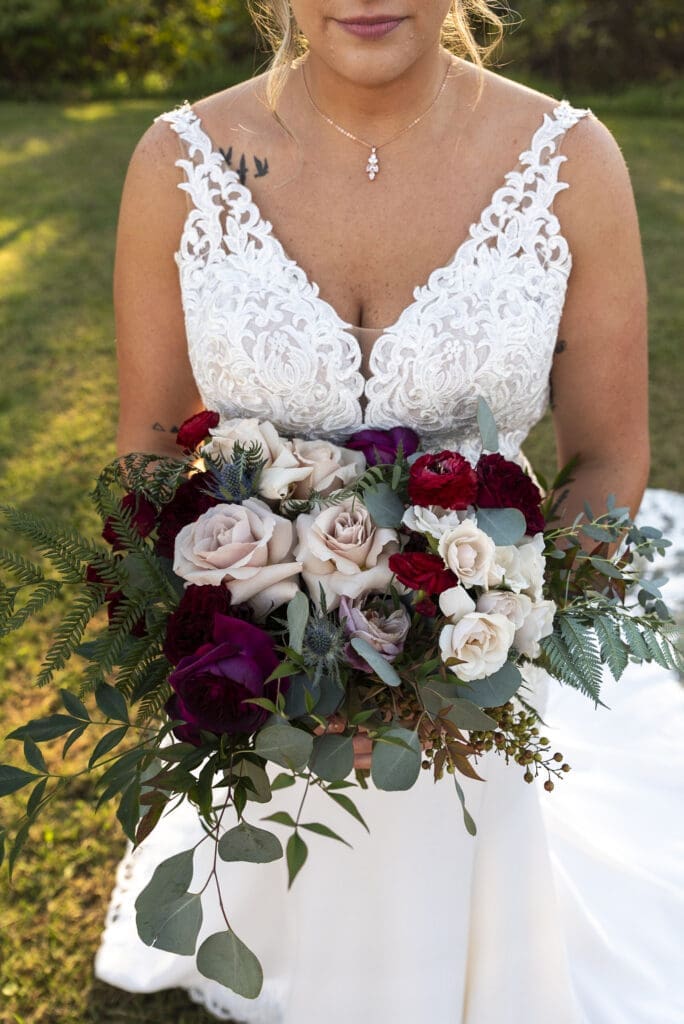 wide detail view of bride holding bouquet