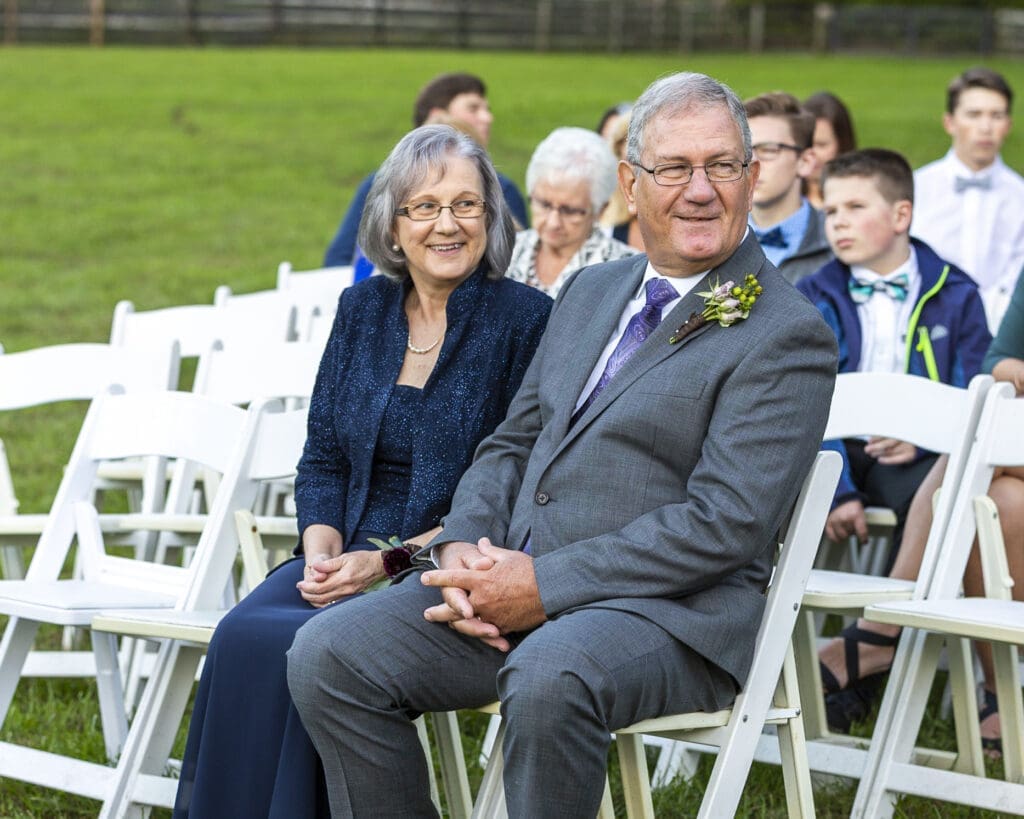 parents of the bride smiling in excitement before ceremony