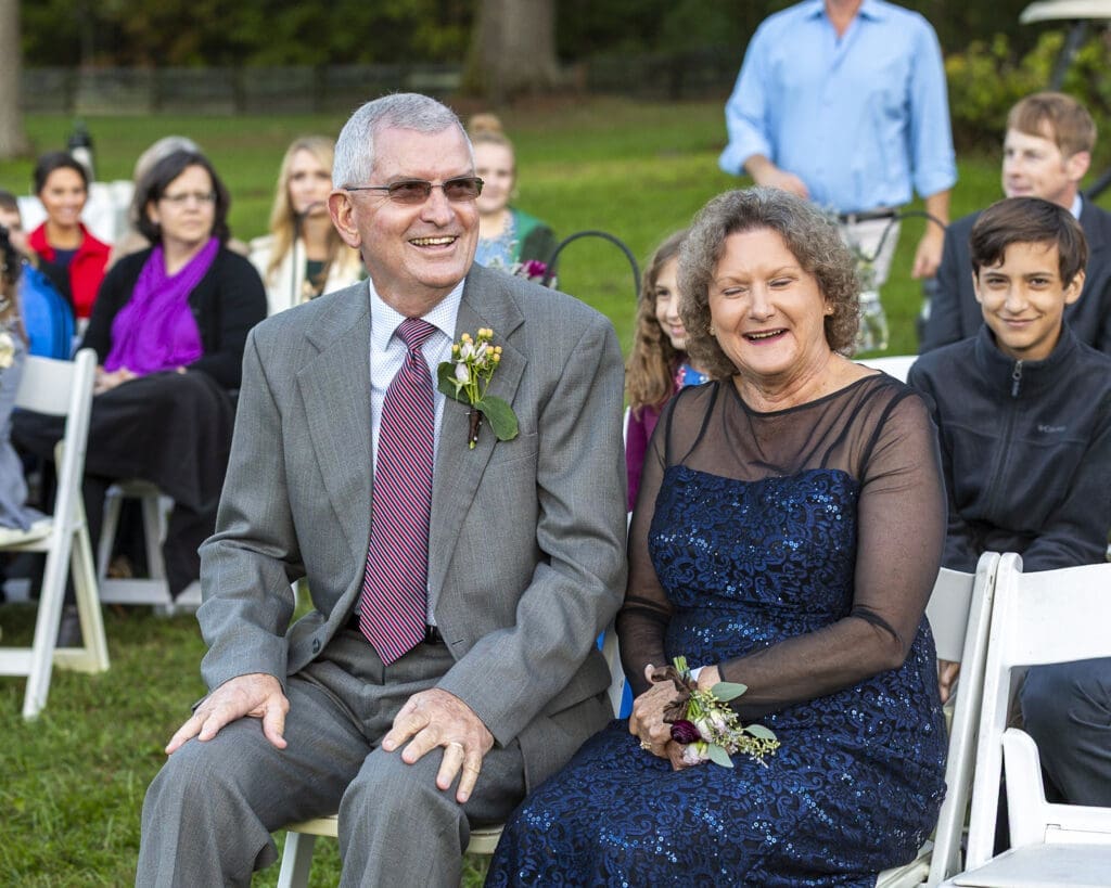 parents of the groom smiling in excitement before ceremony