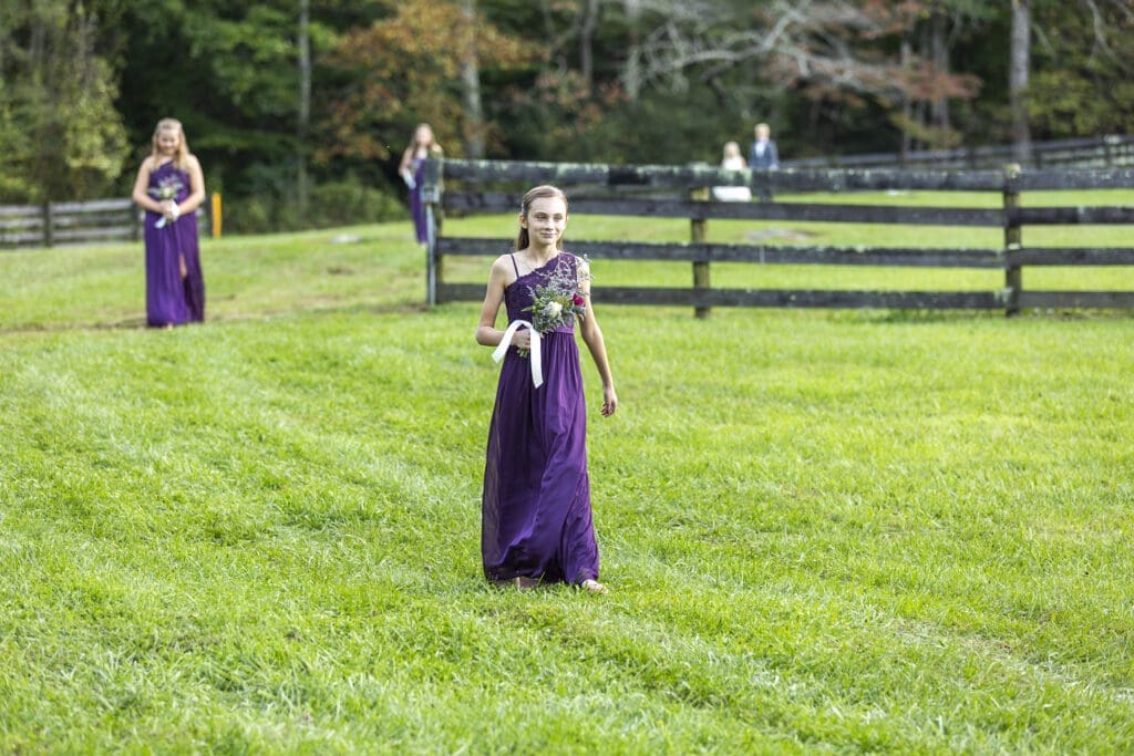 Bridesmaid daughter walking down aisle