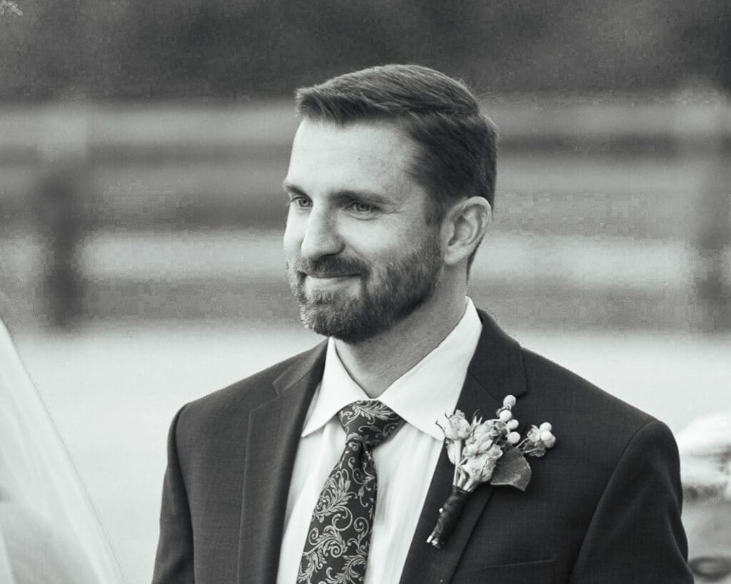 close up of groom during ceremony at fields of blackberry cove