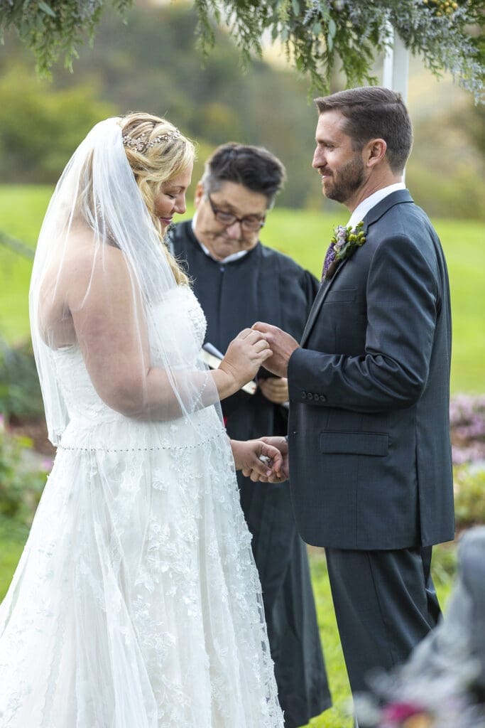 bride and groom ring exchange during ceremony