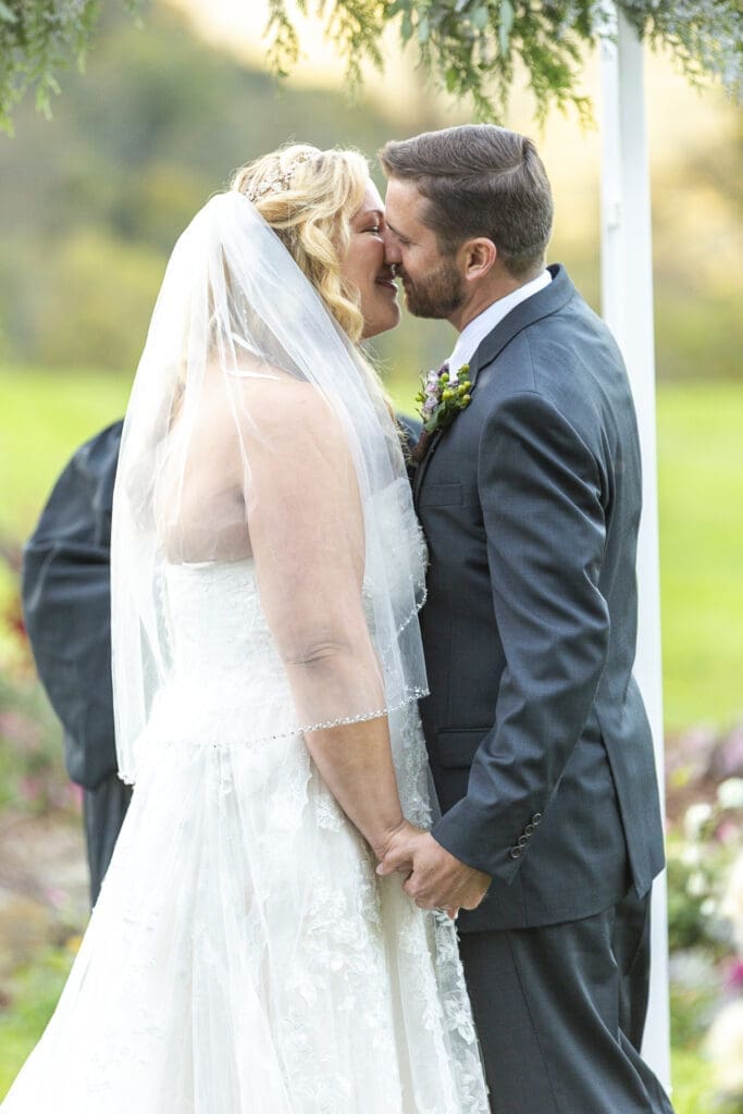Bride and groom first kiss