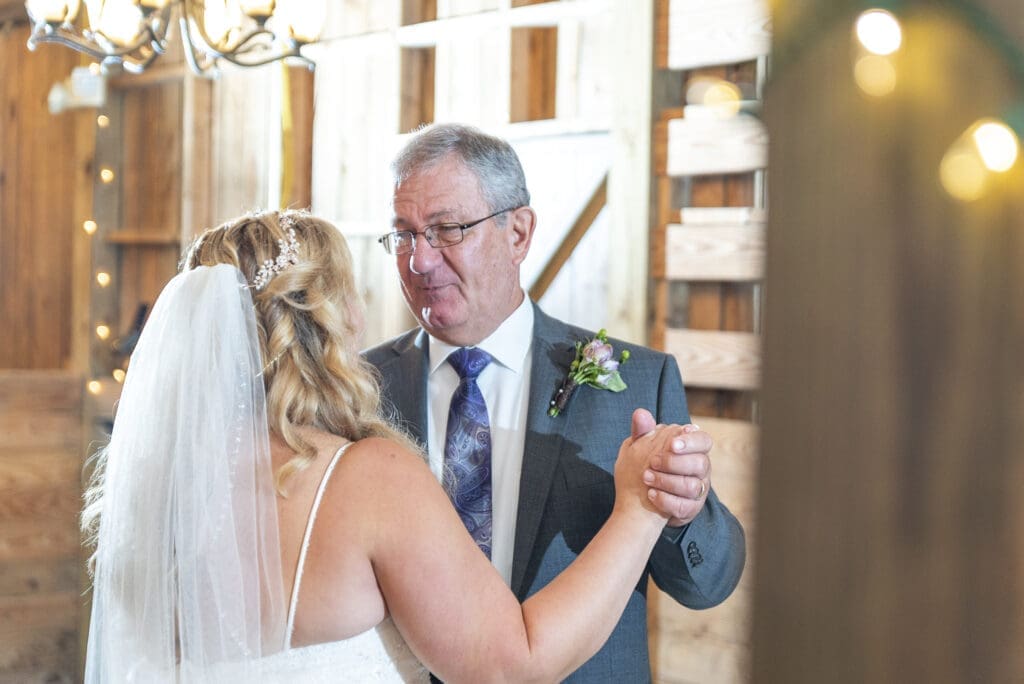 Bride and her father during father daughter dance