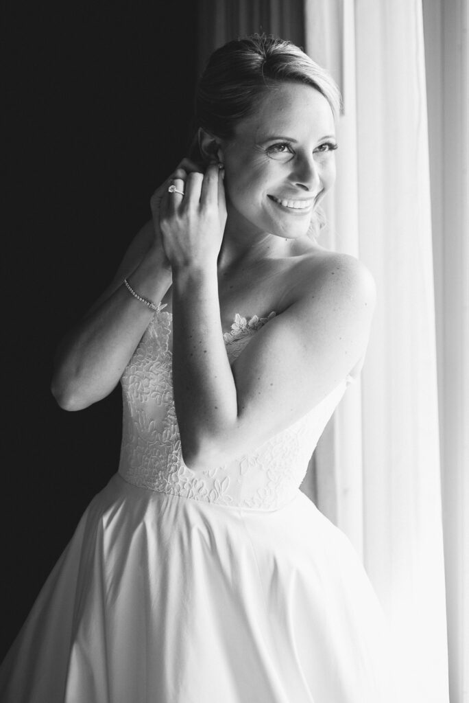 bride putting in earring