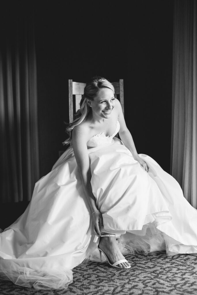 bride putting shoes on