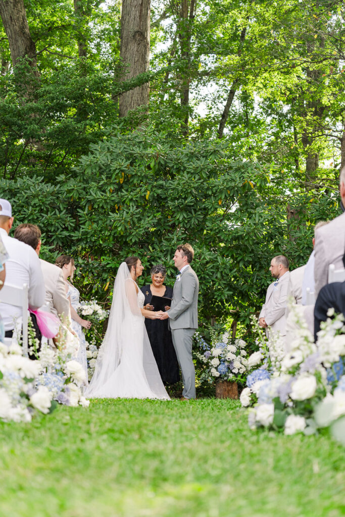 couple exchanging rings during ceremony