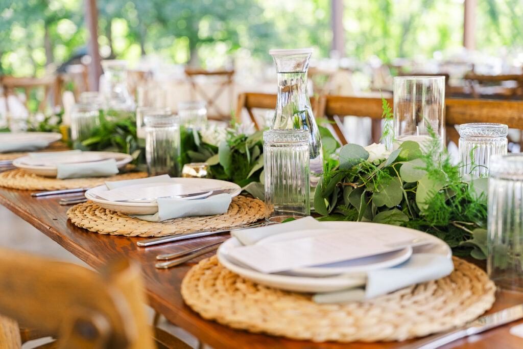 close up of long reception table place settings
