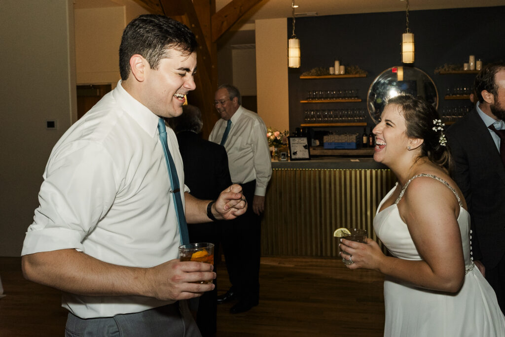 bride and groom dancing near each other during reception.
