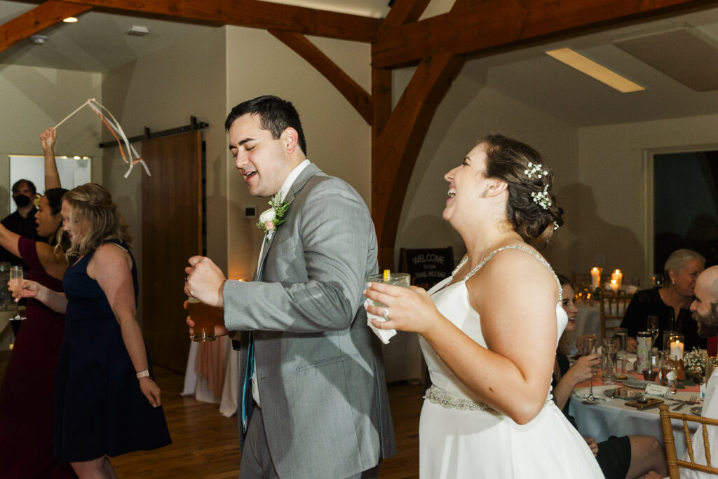 bride and groom dancing next to each other during their reception at Weaver House wedding venue