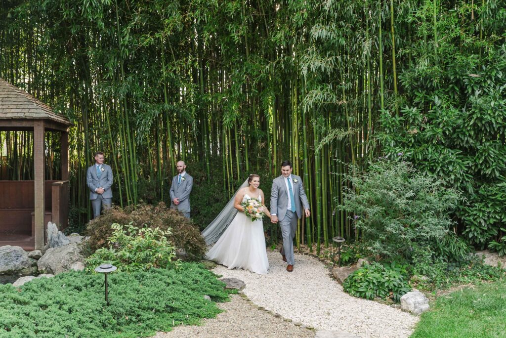 bride and groom walking down aisle after ceremony at Weaver House wedding venue