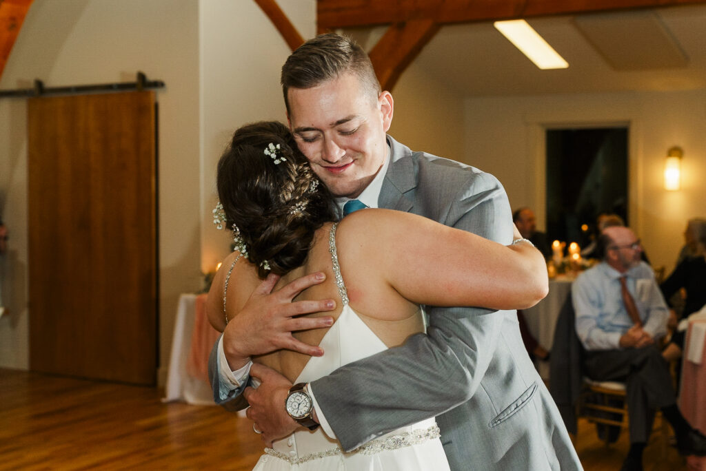 close up of bride hugging her now brother in law