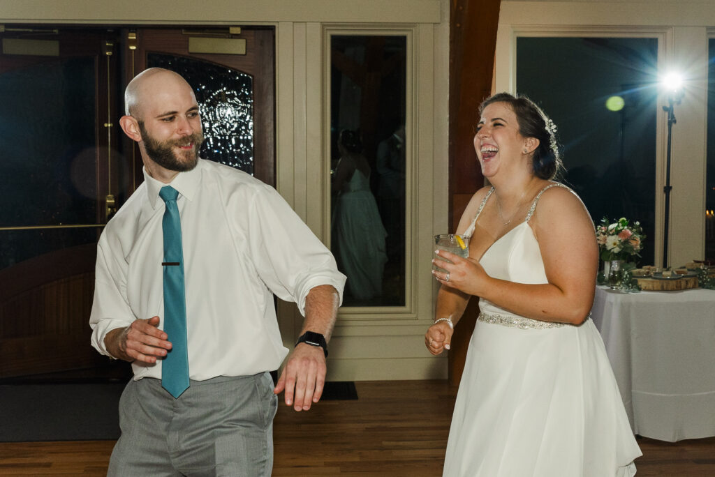 bride and her brother dancing together during the reception at Weaver House wedding venue