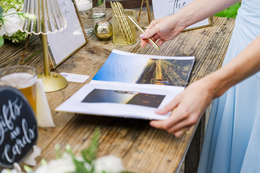 close up of guest looking at the guest book