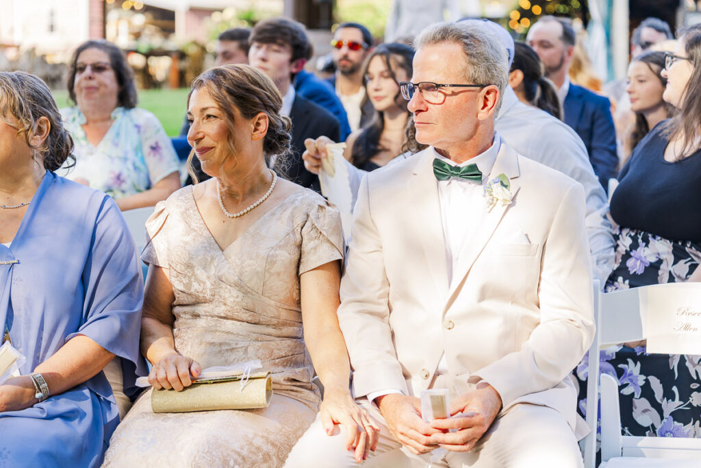 mother of the bride looking proud with teary eyes during ceremony