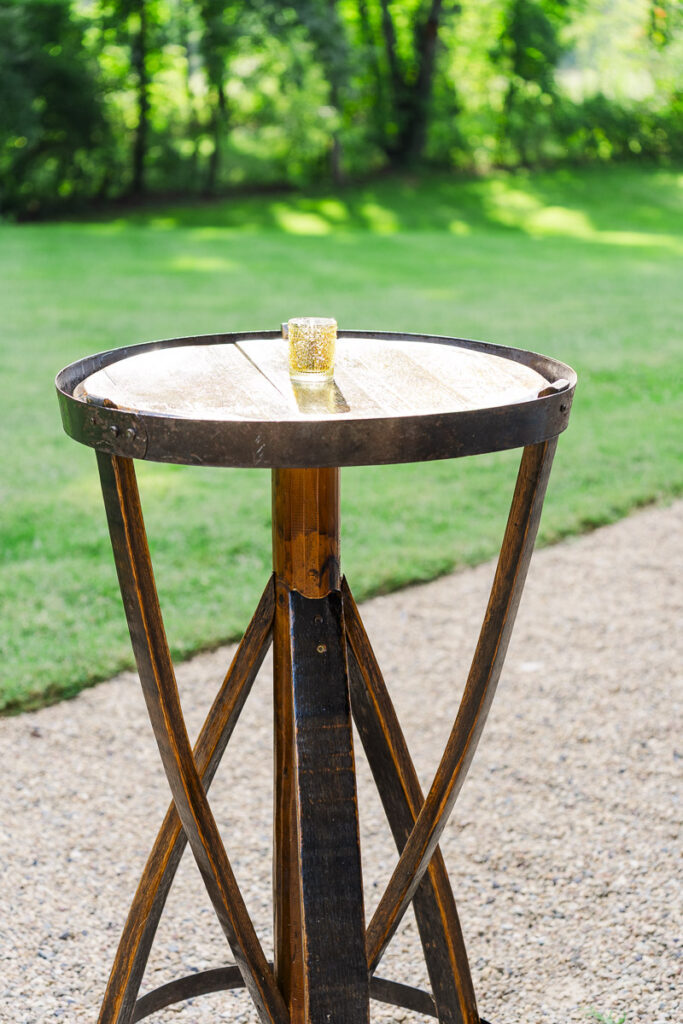 cocktail table with candle at The Farm A Gathering Place Asheville Candler Wedding Venue
