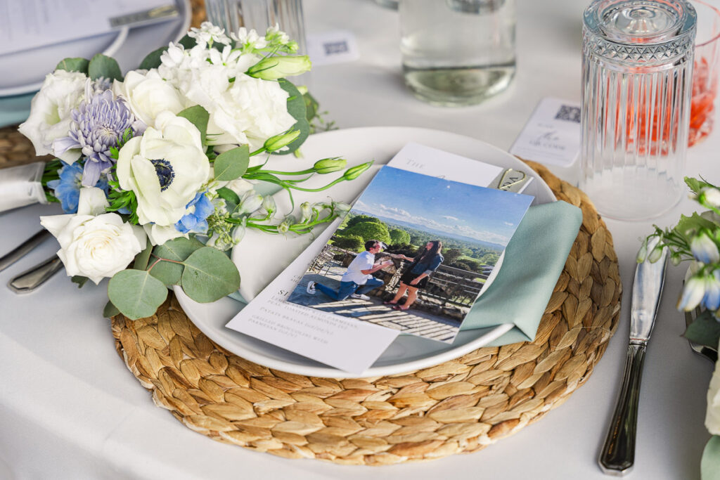 close up of place setting with save the date on top